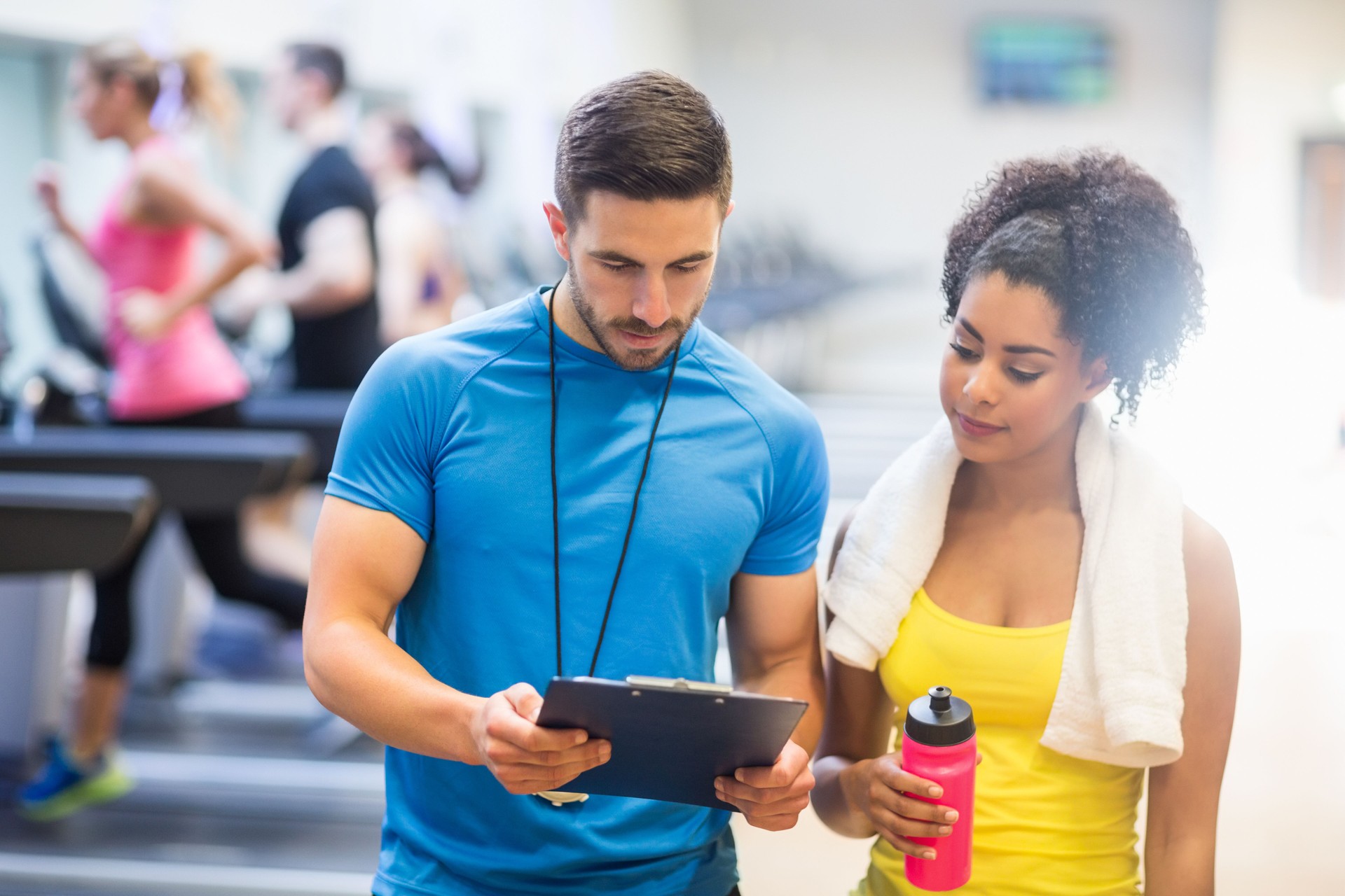 Fit woman talking to her trainer